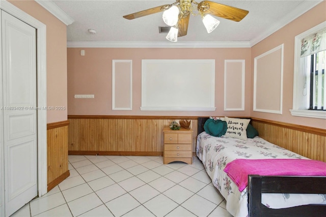 134 E Palm Dr, Margate, FL 33063 - bedroom with wainscoting, ornamental molding, wooden walls, and ceiling fan