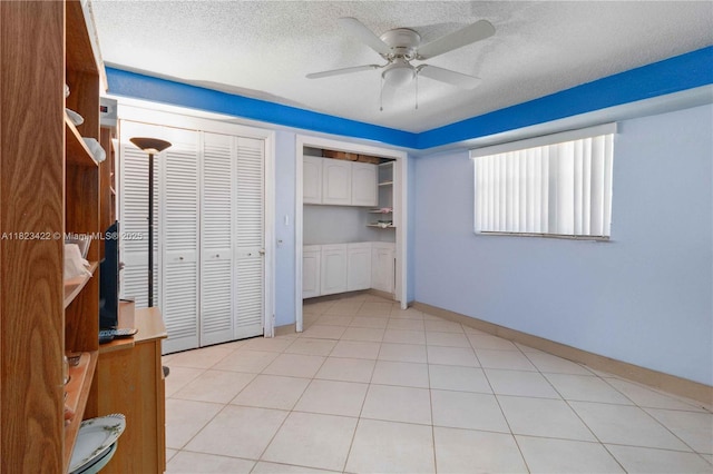 134 E Palm Dr, Margate, FL 33063 - unfurnished bedroom with a ceiling fan, a textured ceiling, and two closets