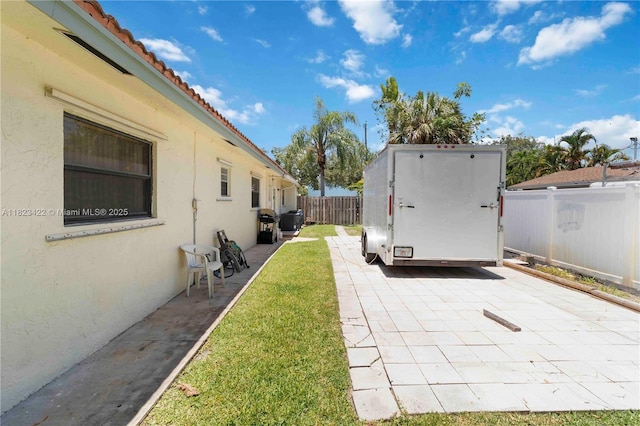 134 E Palm Dr, Margate, FL 33063 - fenced backyard with a patio area