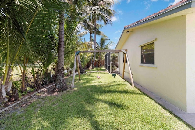 134 E Palm Dr, Margate, FL 33063 - fenced backyard featuring a playground