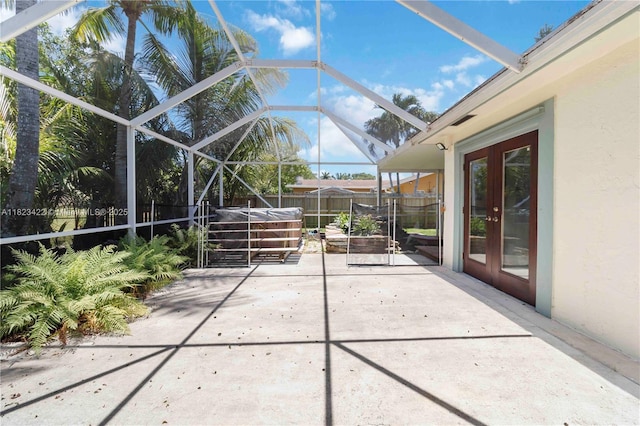 134 E Palm Dr, Margate, FL 33063 - view of patio / terrace featuring a covered hot tub, glass enclosure, and french doors