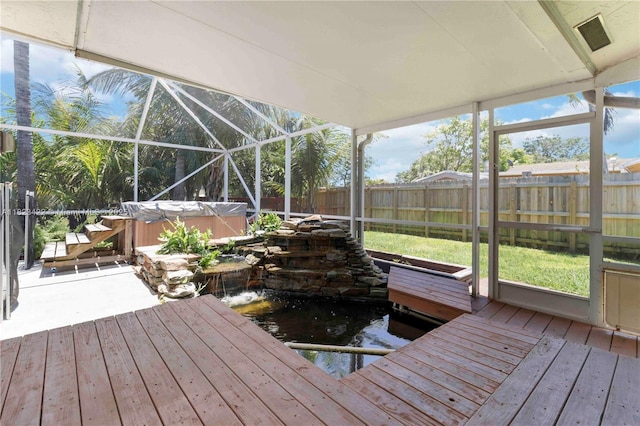 134 E Palm Dr, Margate, FL 33063 - wooden terrace with a hot tub, a small pond, a fenced backyard, and a patio