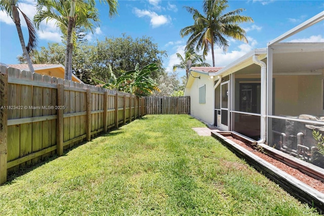 134 E Palm Dr, Margate, FL 33063 - fenced backyard with a sunroom