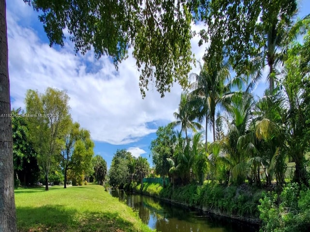 134 E Palm Dr, Margate, FL 33063 - view of home's community with a lawn and a water view