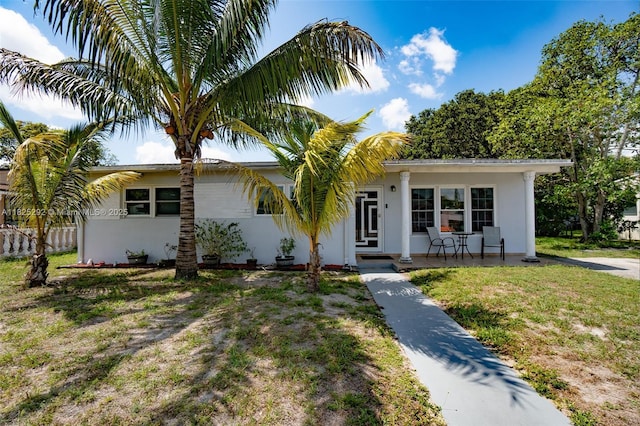 3610 NW 171st St, Miami Gardens, FL 33056 - view of front of property featuring stucco siding, a front yard, and covered porch