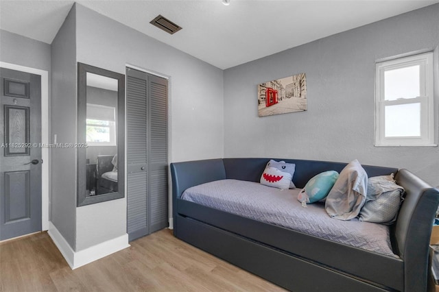 3610 NW 171st St, Miami Gardens, FL 33056 - bedroom featuring wood finished floors and a closet