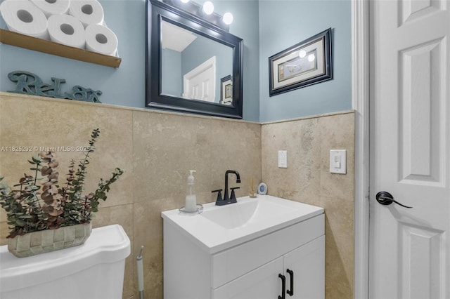 3610 NW 171st St, Miami Gardens, FL 33056 - bathroom featuring tile walls, vanity, and a wainscoted wall