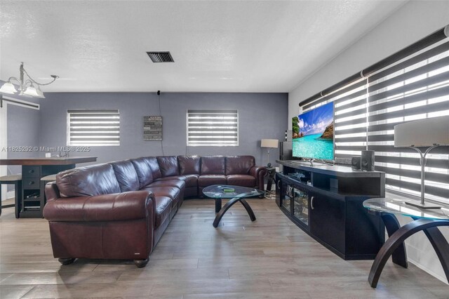 3610 NW 171st St, Miami Gardens, FL 33056 - living area with wood finished floors and a textured ceiling