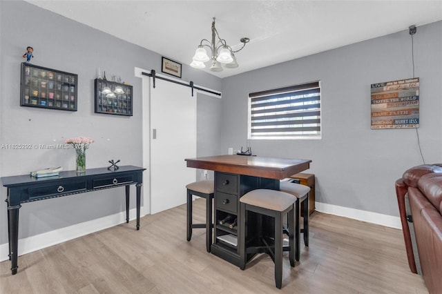 3610 NW 171st St, Miami Gardens, FL 33056 - dining space with a barn door, light wood-style flooring, and a chandelier