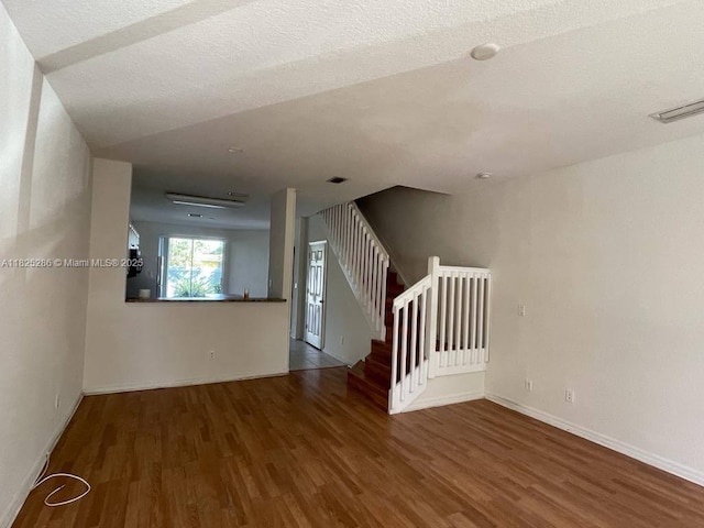 3550 Oleander Ter, Riviera Beach, FL 33404 - unfurnished room with wood finished floors and stairway