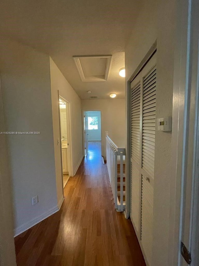 3550 Oleander Ter, Riviera Beach, FL 33404 - hallway with wood finished floors and an upstairs landing