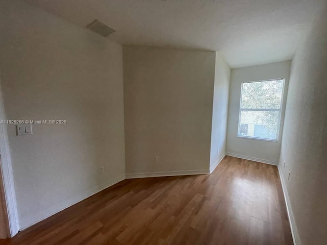 3550 Oleander Ter, Riviera Beach, FL 33404 - empty room with wood finished floors and baseboards