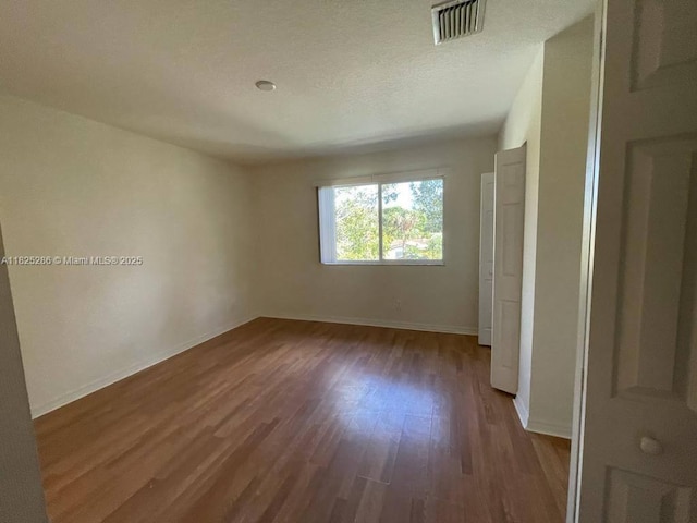 3550 Oleander Ter, Riviera Beach, FL 33404 - empty room with wood finished floors and baseboards