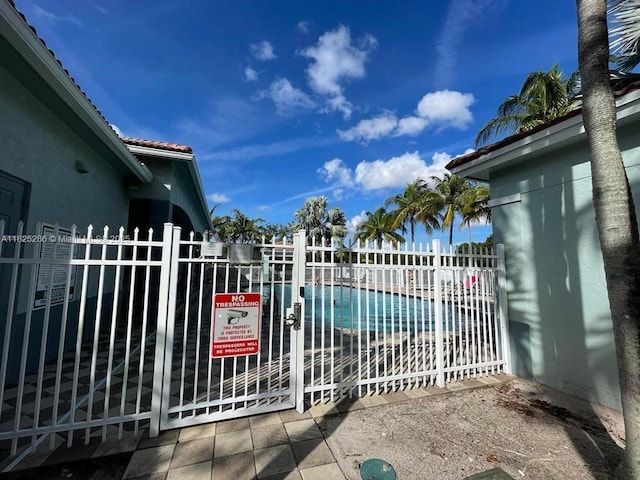 3550 Oleander Ter, Riviera Beach, FL 33404 - gate with a community pool