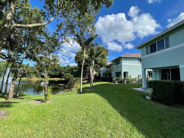 3550 Oleander Ter, Riviera Beach, FL 33404 - view of grassy yard with a water view