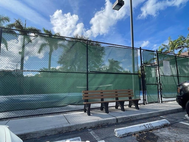 3550 Oleander Ter, Riviera Beach, FL 33404 - view of tennis court with a gate