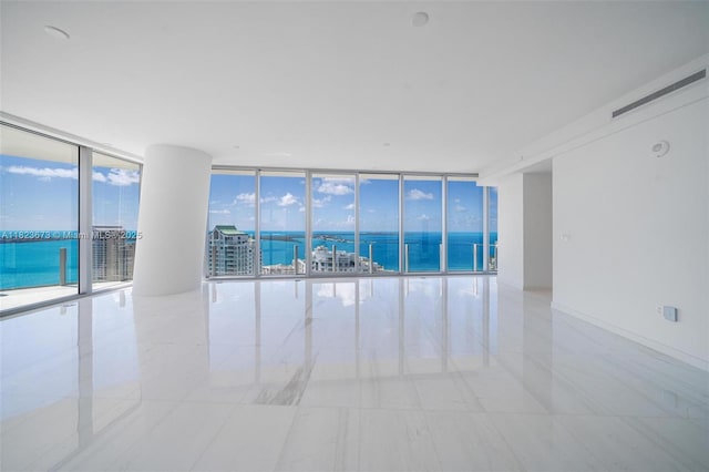300 Biscayne Blvd Way Unit 4301, Miami, FL 33131 - spare room with expansive windows, a water view, and light tile patterned floors