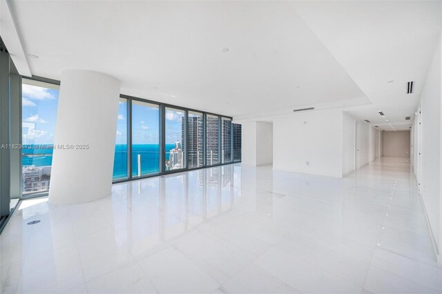 300 Biscayne Blvd Way Unit 4301, Miami, FL 33131 - unfurnished room with floor to ceiling windows, light tile patterned flooring, a water view, and healthy amount of natural light
