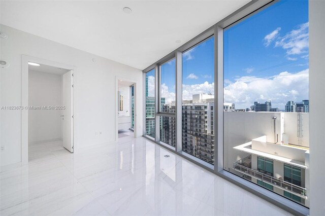 300 Biscayne Blvd Way Unit 4301, Miami, FL 33131 - unfurnished room with expansive windows, a view of city, and tile patterned flooring