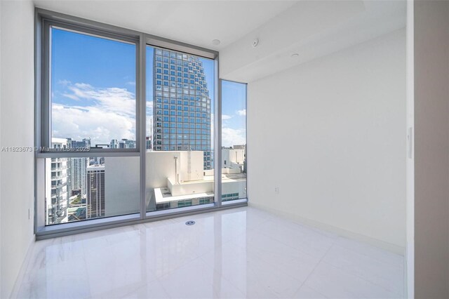 300 Biscayne Blvd Way Unit 4301, Miami, FL 33131 - tiled empty room with a view of city and floor to ceiling windows