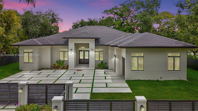 7025 SW 80th Ct, Miami, FL 33143 - view of front facade with stucco siding, a tile roof, and a fenced front yard
