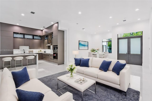 7025 SW 80th Ct, Miami, FL 33143 - living room featuring recessed lighting, light tile patterned floors, and french doors