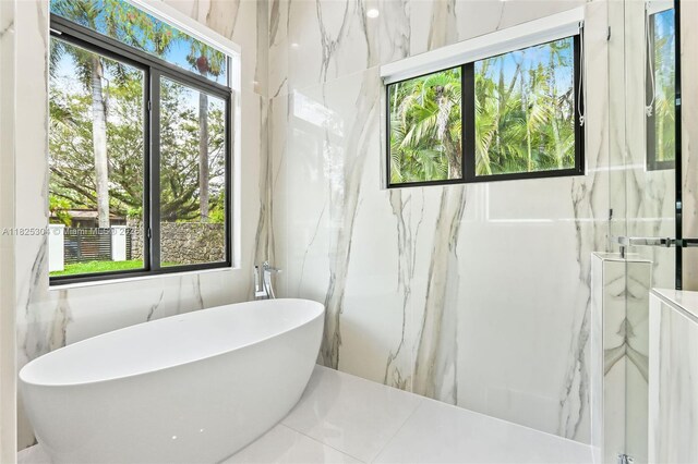 7025 SW 80th Ct, Miami, FL 33143 - bathroom with a freestanding tub and a marble finish shower