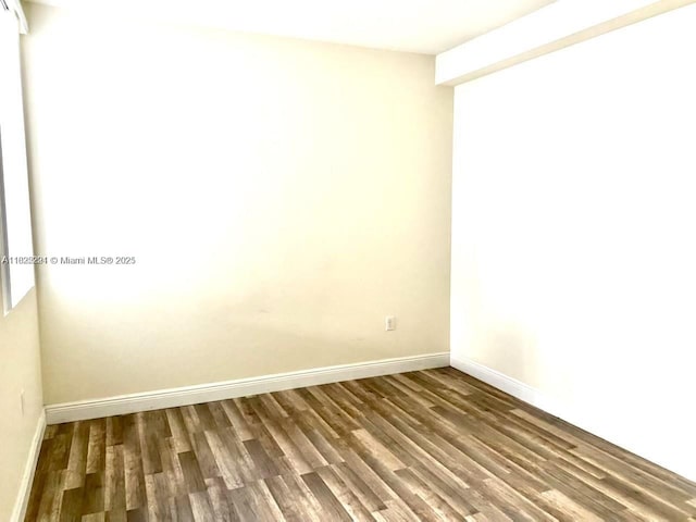 3339 Virginia St Unit 205, Miami, FL 33133 - spare room with wood finished floors and baseboards