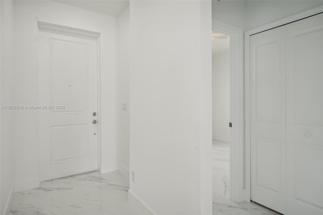 3411 62nd St W, Lehigh Acres, FL 33971 - hallway with light marble finish floors and baseboards