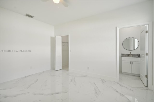 3411 62nd St W, Lehigh Acres, FL 33971 - unfurnished room featuring a ceiling fan and light marble finish flooring