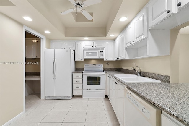 608 Saint Andrews Rd Unit 46, Hollywood, FL 33021 - kitchen with white appliances, recessed lighting, white cabinetry, light tile patterned floors, and a tray ceiling