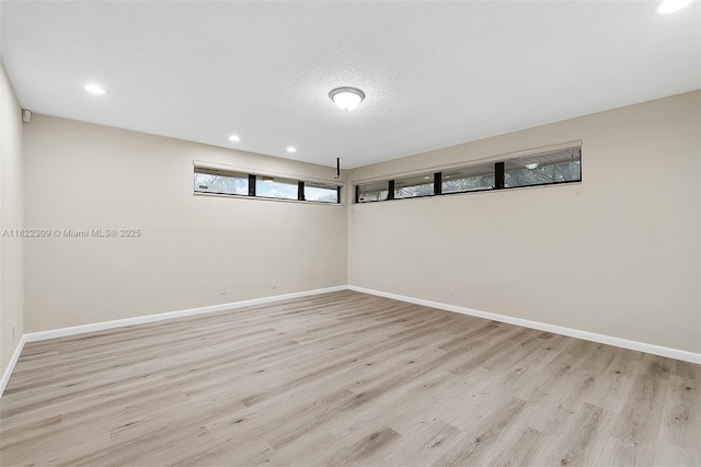 608 Saint Andrews Rd Unit 46, Hollywood, FL 33021 - unfurnished room with light wood-style flooring, recessed lighting, and a textured ceiling