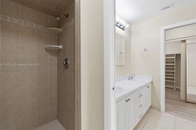 608 Saint Andrews Rd Unit 46, Hollywood, FL 33021 - full bathroom with double vanity, tile patterned floors, tiled shower, and a walk in closet