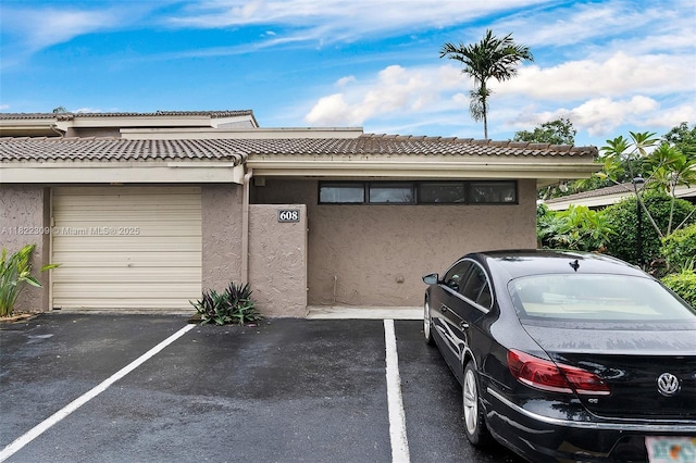 608 Saint Andrews Rd Unit 46, Hollywood, FL 33021 - view of front of property with stucco siding, uncovered parking, and a tile roof