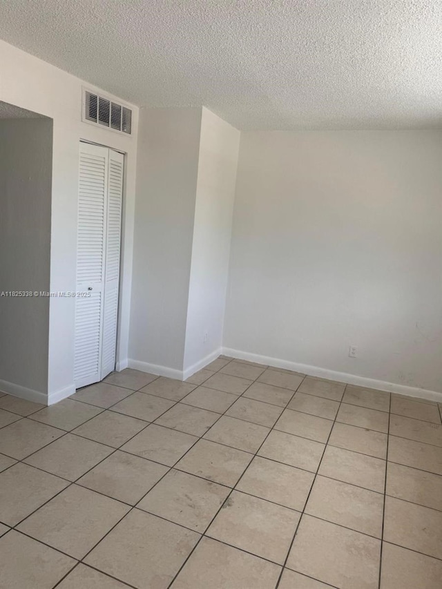 4045 NW 19th St, Lauderhill, FL 33313 - spare room featuring a textured ceiling and light tile patterned floors