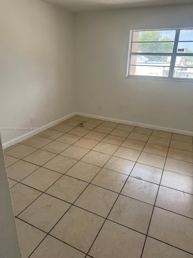 4045 NW 19th St, Lauderhill, FL 33313 - unfurnished room featuring light tile patterned flooring and baseboards