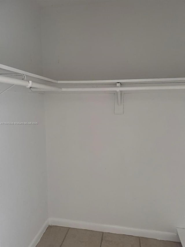 4045 NW 19th St, Lauderhill, FL 33313 - spacious closet featuring light tile patterned floors