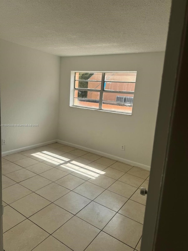 4045 NW 19th St, Lauderhill, FL 33313 - spare room with light tile patterned floors and a textured ceiling