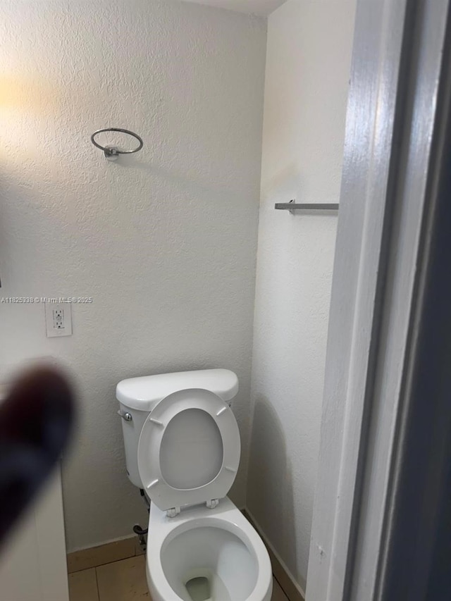 4045 NW 19th St, Lauderhill, FL 33313 - bathroom featuring toilet and tile patterned floors