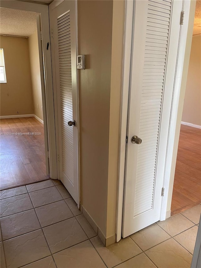 8325 Sunrise Lakes Blvd Unit 305, Sunrise, FL 33322 - corridor featuring light tile patterned floors