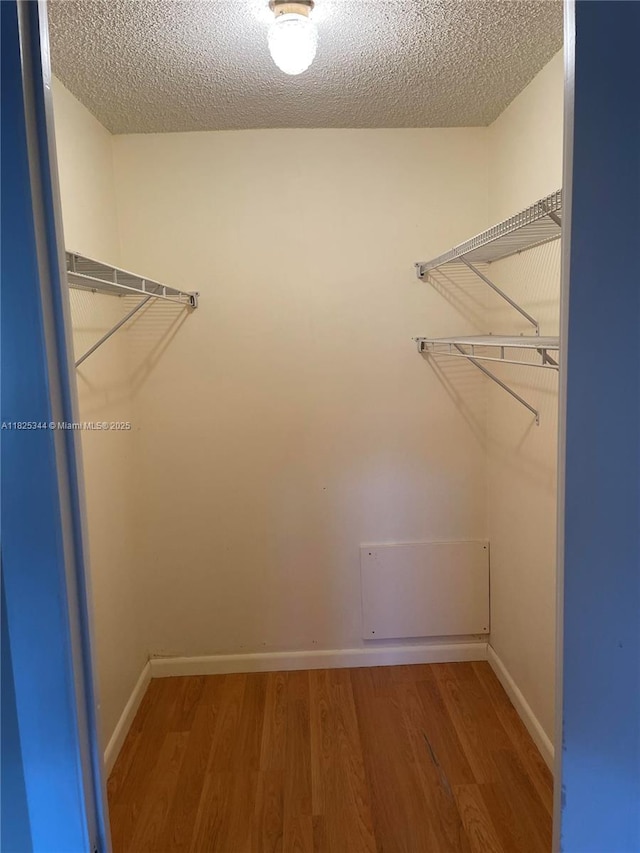 8325 Sunrise Lakes Blvd Unit 305, Sunrise, FL 33322 - spacious closet featuring wood finished floors