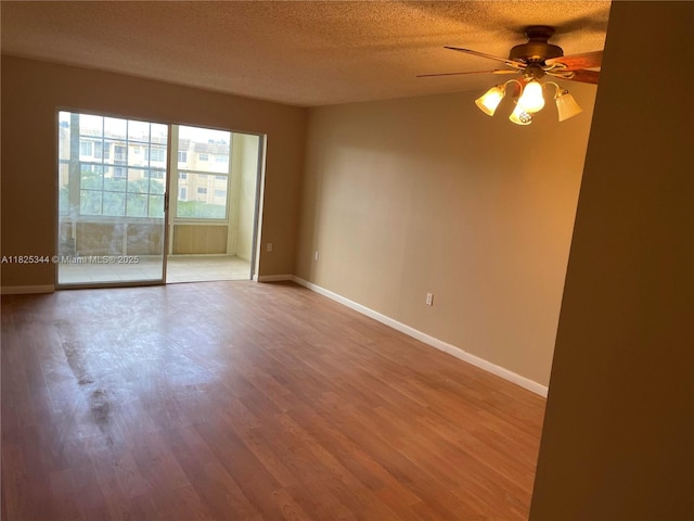 8325 Sunrise Lakes Blvd Unit 305, Sunrise, FL 33322 - unfurnished room with a ceiling fan, a textured ceiling, and wood finished floors