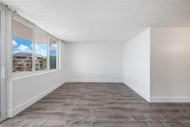 10700 SW 108th Ave Unit C316, Miami, FL 33176 - unfurnished room with a textured ceiling and wood finished floors