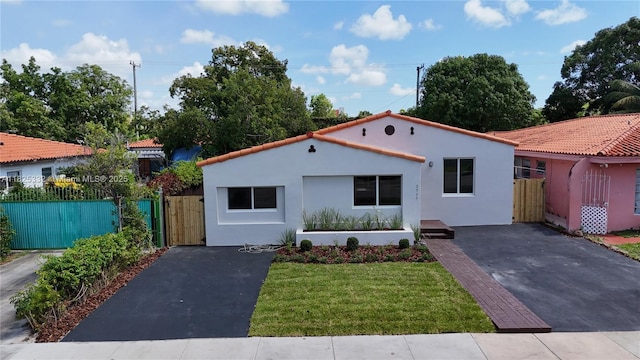 2949 SW 14th St, Miami, FL 33145 - mediterranean / spanish house featuring stucco siding, driveway, and a gate