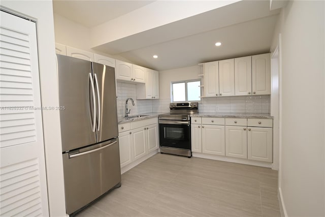 2949 SW 14th St, Miami, FL 33145 - kitchen with appliances with stainless steel finishes, decorative backsplash, light stone counters, white cabinetry, and recessed lighting