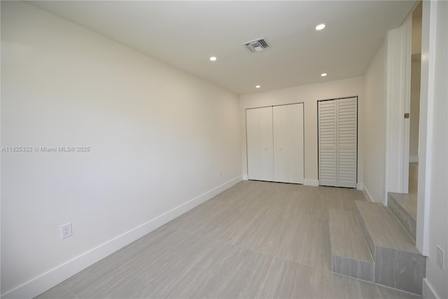 2949 SW 14th St, Miami, FL 33145 - unfurnished bedroom featuring multiple closets and recessed lighting