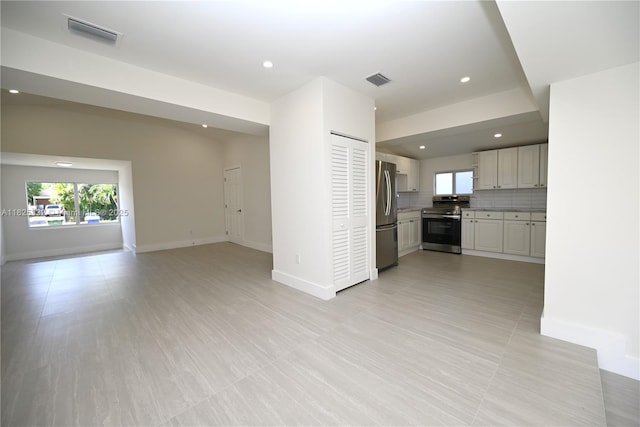 2949 SW 14th St, Miami, FL 33145 - unfurnished living room with healthy amount of natural light and recessed lighting