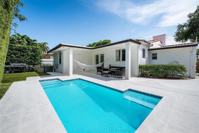 443 SW 18th Rd, Miami, FL 33129 - back of property with a patio and stucco siding