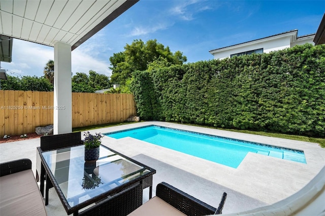 443 SW 18th Rd, Miami, FL 33129 - view of swimming pool featuring a patio and a fenced backyard