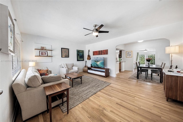 443 SW 18th Rd, Miami, FL 33129 - living room featuring ceiling fan, arched walkways, and light wood-type flooring